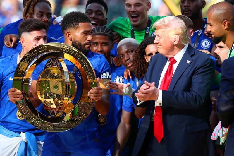 EAST RUTHERFORD, NEW JERSEY - JULY 13: Reece James of Chelsea looks towards U.S President Donald Trump as he prepares to lift the trophy following the FIFA Club World Cup 2025 final match between Chelsea FC and Paris Saint-Germain at MetLife Stadium on July 13, 2025 in East Rutherford, New Jersey. (Photo by Chris Brunskill/Fantasista/Getty Images)