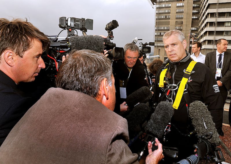 Britain's Prince Andrew, Duke of York, talks to the media after abseiling down the Shard for charity in central London on September 3, 2012. The 52-year-old royal lowered himself from the 87th to the 20th floor of Europe's tallest building as part of an effort with others to raise money for educational charity The Outward Bound Trust and the Royal Marines Charitable Trust Fund. AFP PHOTO / POOL / JOHN STILLWELL (Photo credit should read JOHN STILLWELL/AFP/GettyImages)