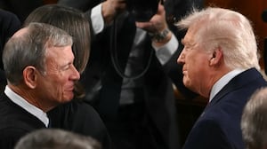 President Donald Trump shakes hands with Supreme Court Chief Justice John Roberts as he arrives to deliver his State of the Union address in the House Chamber of the US Capitol in Washington, DC, on February 24, 2026.