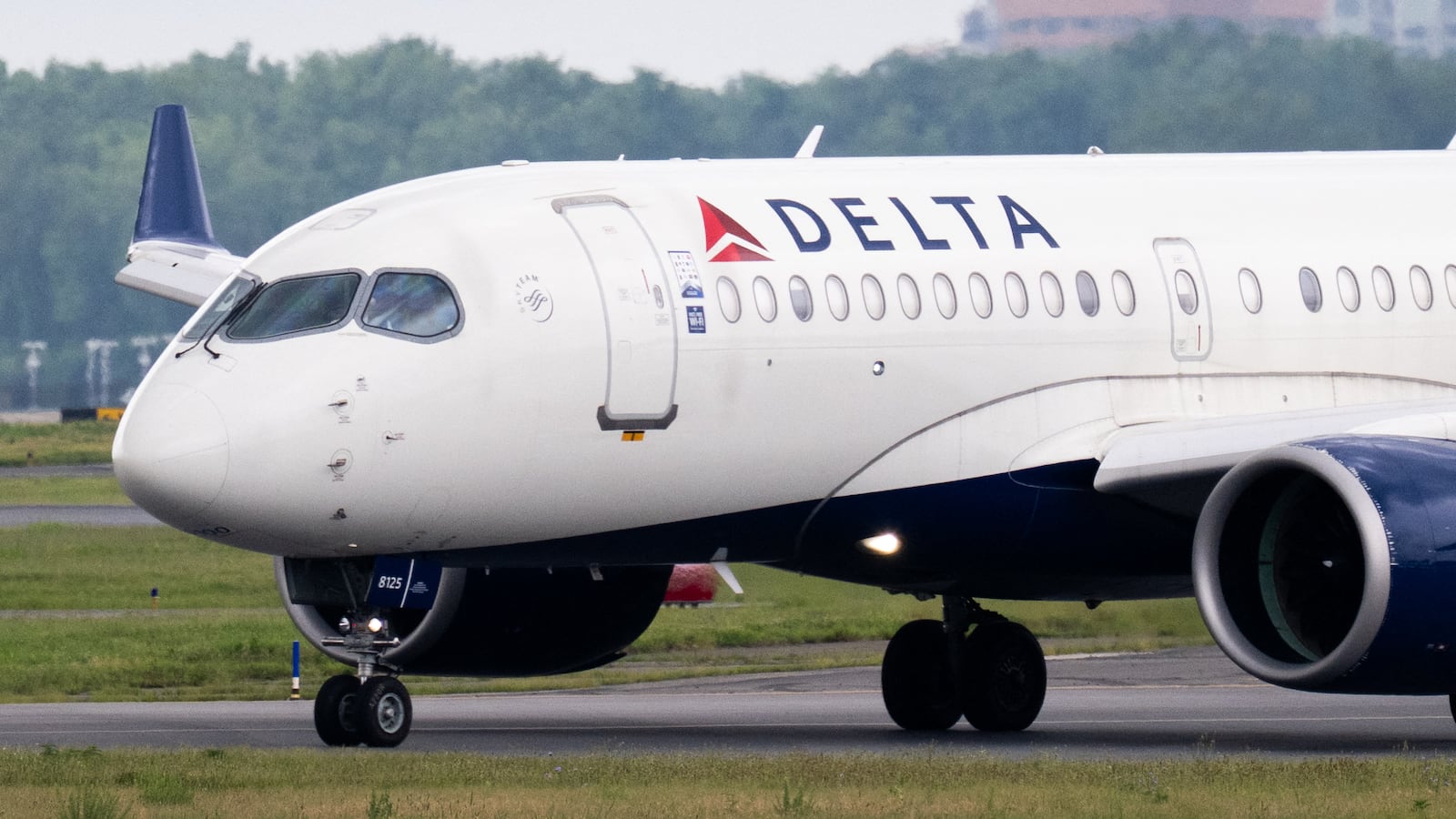 A Delta Air Lines Airbus A220 airplane prepares to takeoff at Ronald Reagan Washington National Airport in Arlington, Virginia, on July 10, 2025. Delta Air Lines stock shares surged more than 11 percent in early trading on Thursday, as the airline reported better-than-expected results. Between April and June, the group posted year-on-year sales of $16.65 billion and net income of $2.13 billion (+63% year-on-year). (Photo by SAUL LOEB / AFP) (Photo by SAUL LOEB/AFP via Getty Images)