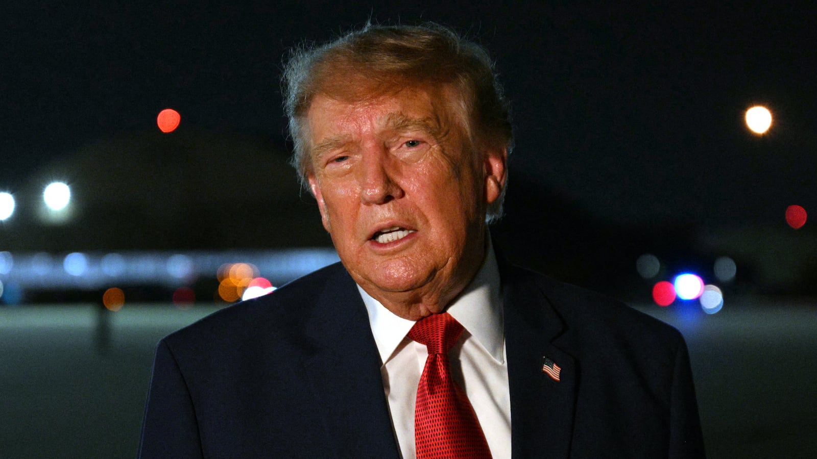 President Donald Trump speaks with reporters after landing at Joint Base Andrews, Maryland, upon his return from Ohio where he attended the Patriot Games finals, on August 11, 2026.