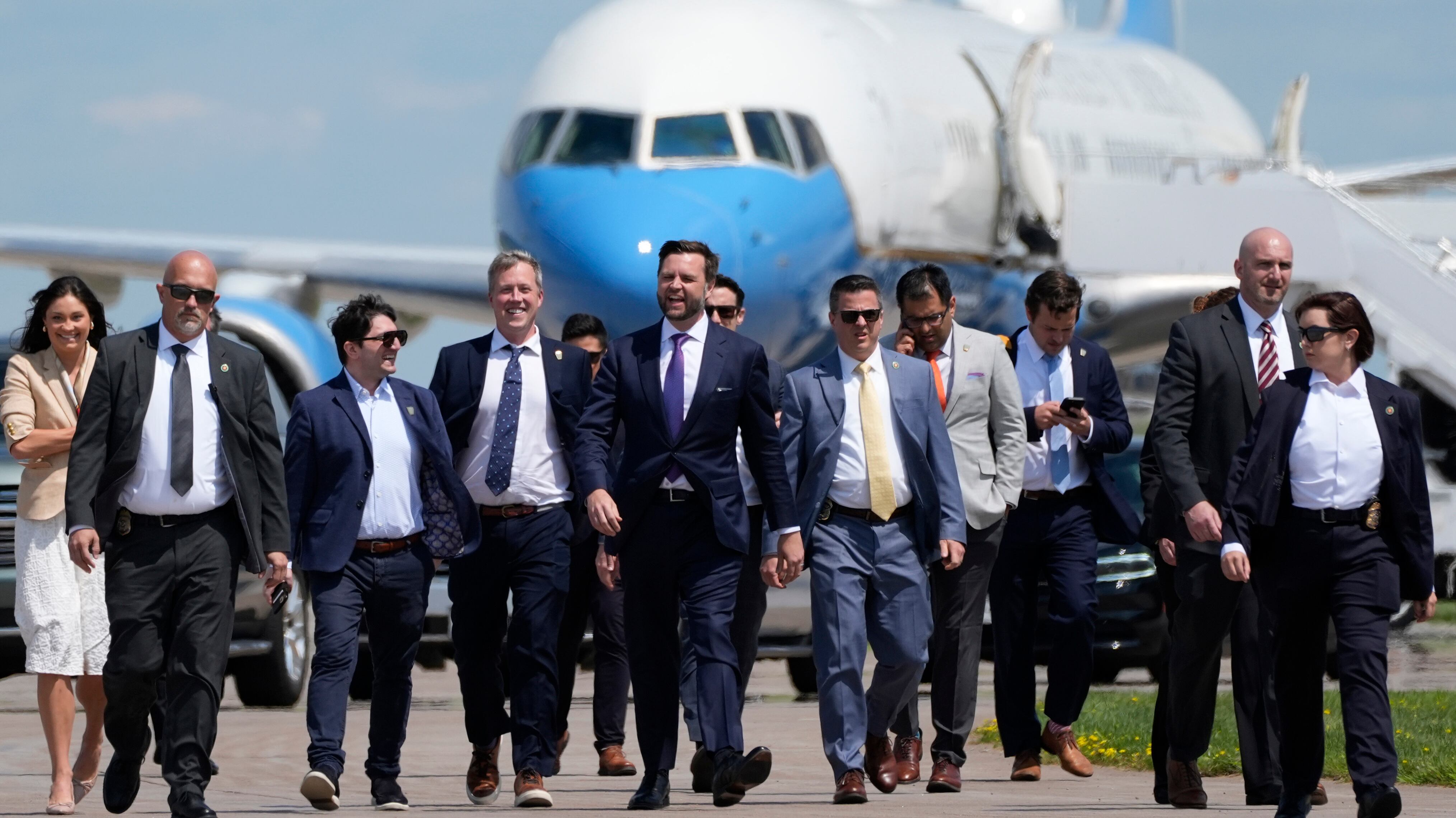 Republican vice presidential nominee Sen. JD Vance walks back from looking at Air Force Two.