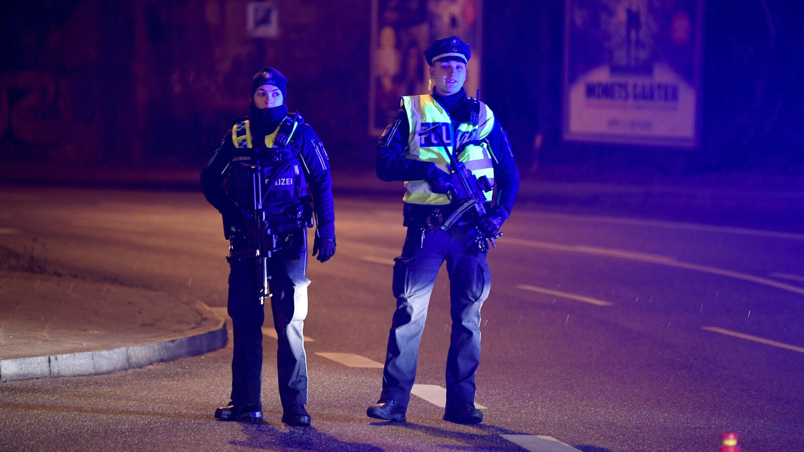 Police secures the area after at least six people are dead and several more injured in a shooting in the northern German city of Hamburg, Germany