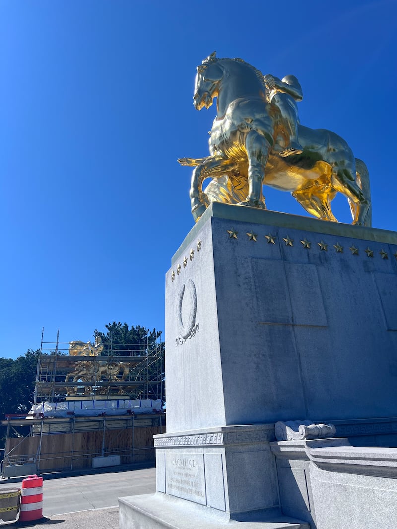 The newly gilded Arts of War sculptures have been partly unveiled but the work continues.