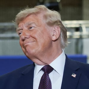 U.S. President Donald Trump reacts as he arrives to deliver remarks during a visit to a Mack Trucks' assembly plant, in Macungie, Pennsylvania, U.S., June 23, 2026.