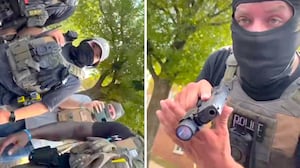 ICE Agents and one with his gun drawn.