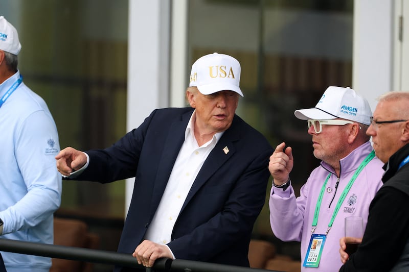 U.S. President Donald Trump watches golf at Trump International Golf Links in Doonbeg, County Clare, Ireland, September 12, 2026. REUTERS/Cathal McNaughton