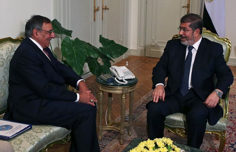 articles/2012/12/11/america-s-bizarre-morsi-embrace/morsi-panetta_zuzqco