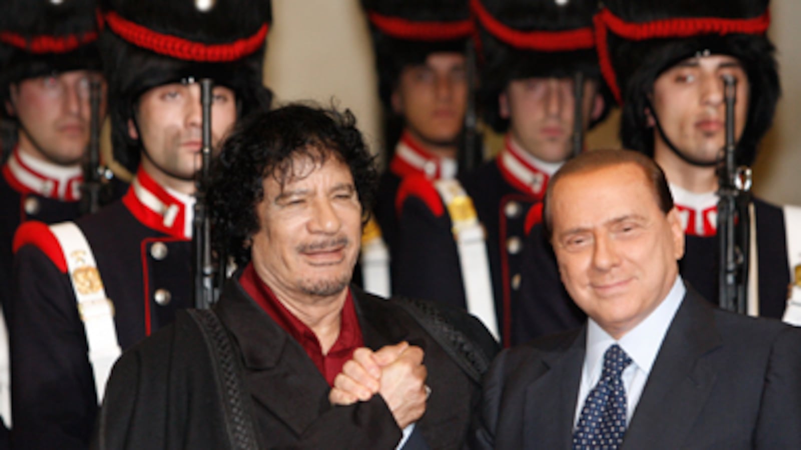 articles/2011/03/23/berlusconi-and-qaddafi-their-close-friendship/nadeau-gaddafi-exile_168649_ml6c9w