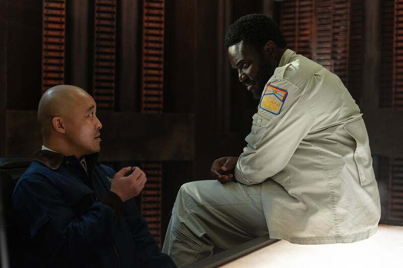 Andy Yu as Teng and Babou Ceesay as Morrow.