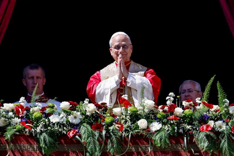Pope Leo XIV gestures from the main balcony of St. Peter's Basilica after delivering his "Urbi et Orbi" (To the city and the world) message, on Easter Sunday at the Vatican, April 5, 2026.
