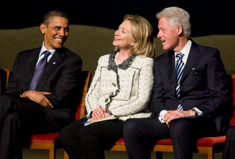 WASHINGTON, DC - JANUARY 14:  (AFP OUT)  (L - R) U.S. President Barack Obama, U.S. Secretary of State Hillary Clinton, and Former U.S. President Bill Clinton attend a memorial service for Ambassador Richard Holbrooke on January 14, 2011 at the Kennedy Center in Washington, D.C.  Holbrooke passed away in December after undergoing heart surgery to repair a tear in his aorta.  (Photo by Kristoffer Tripplaar-Pool/Getty Images)