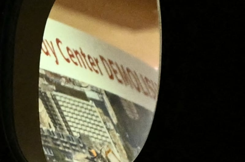 A close up of the Kennedy Center poster Donald Trump was inspecting appears to say "DEMOLISHED."