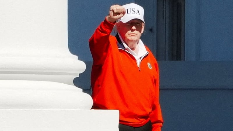President Donald Trump raises his fist as he returns to the White House from his golf club on May 31, 2026, just hours before raging about coverage of the Iran talks in a post.
