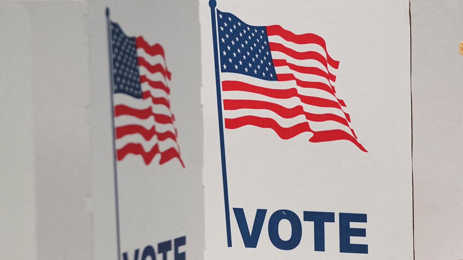 A voter casts her ballot at a polling station on Election Day in Falls Church, Virginia