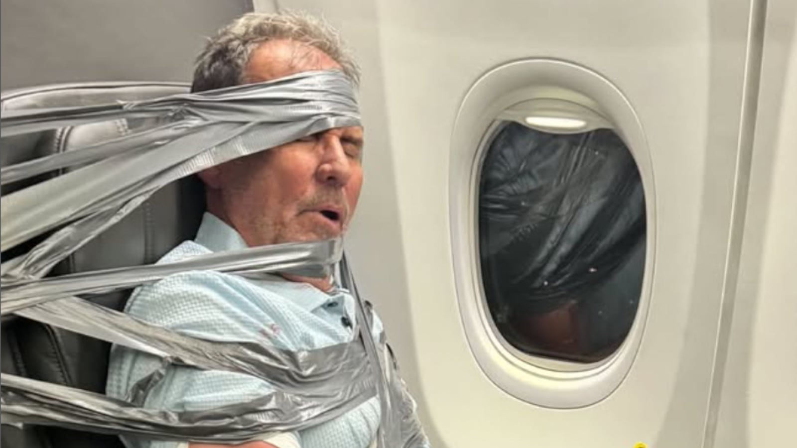 A passenger is detained with duct tape on an American Airlines flight from Dallas to Newark.
