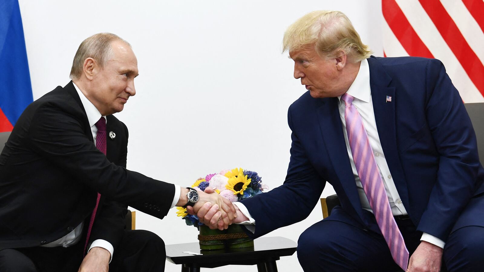 US President Donald Trump (R) attends a meeting with Russia's President Vladimir Putin during the G20 summit in Osaka on June 28, 2019. (Photo by Brendan Smialowski / AFP) (Photo by BRENDAN SMIALOWSKI/AFP via Getty Images)