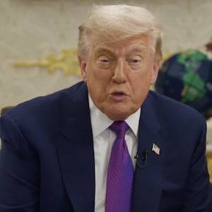 President Donald Trump "reads" to children from the Oval Office.