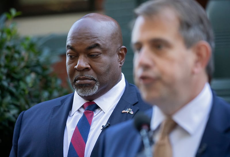 North Carolina Lt. Gov. Mark Robinson, left, the Republican nominee for governor, listens during a press conference on Tuesday, Oct. 15, 2024, in Raleigh, North Carolina. (Kaitlin McKeown/The News & Observer/Tribune News Service via Getty Images)