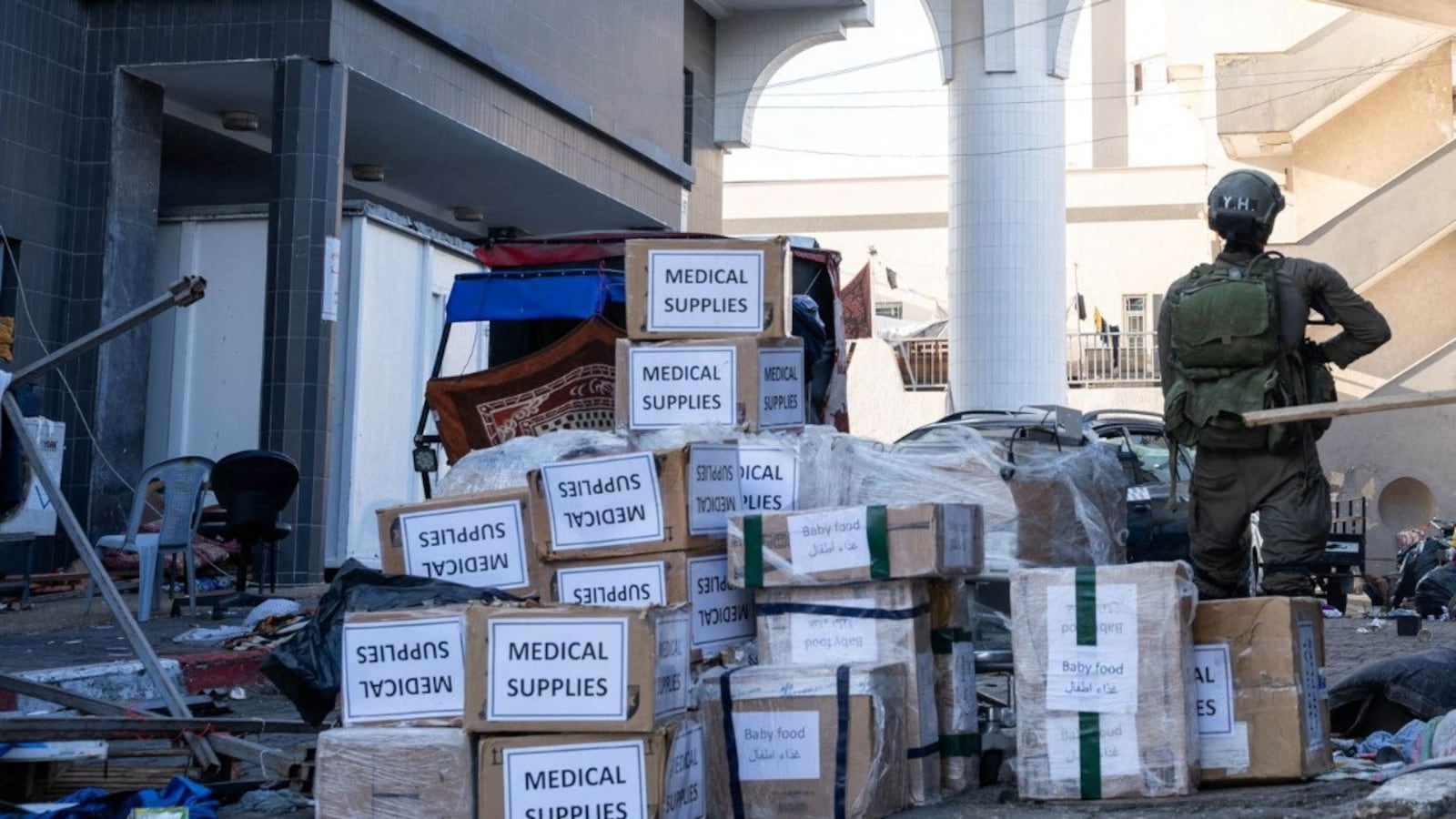 Israeli soldier stands near boxes labelled Medical Supplies at the Al Shifa hospital complex.
