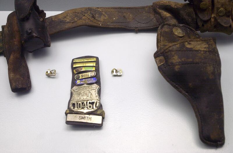The Police Museum on Water Street in Lower Manhattan features a special 9-11 tribute starting today. Display shows some of what was recovered of police officers at Ground Zero, including gun belt and badge of Police Officer Moira Smith. (Photo by Todd Maisel/NY Daily News via Getty Images)
