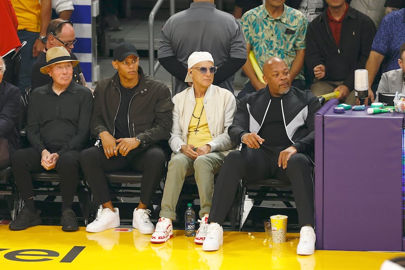 David Geffen, Donovan Michaels, Jimmy Iovine and Dr. Dre sit court side at a Los Angeles Lakers game in 2023.