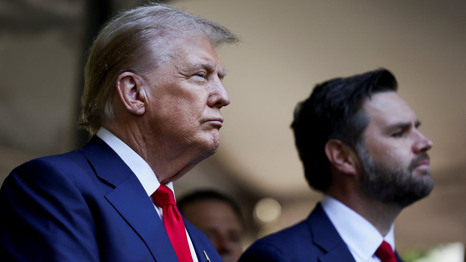 Donald Trump and J.D. Vance stand together.