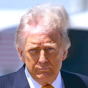 US President Donald Trump gestures prior boarding Air Force One at Joint Base Andrews, Maryland, on May 12, 2026.
