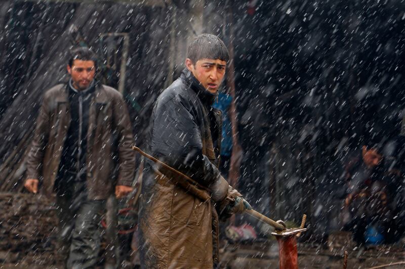 galleries/2014/03/08/the-week-in-photos-march-8-2014/140306-wip-afgahn-worker_qxdpdk