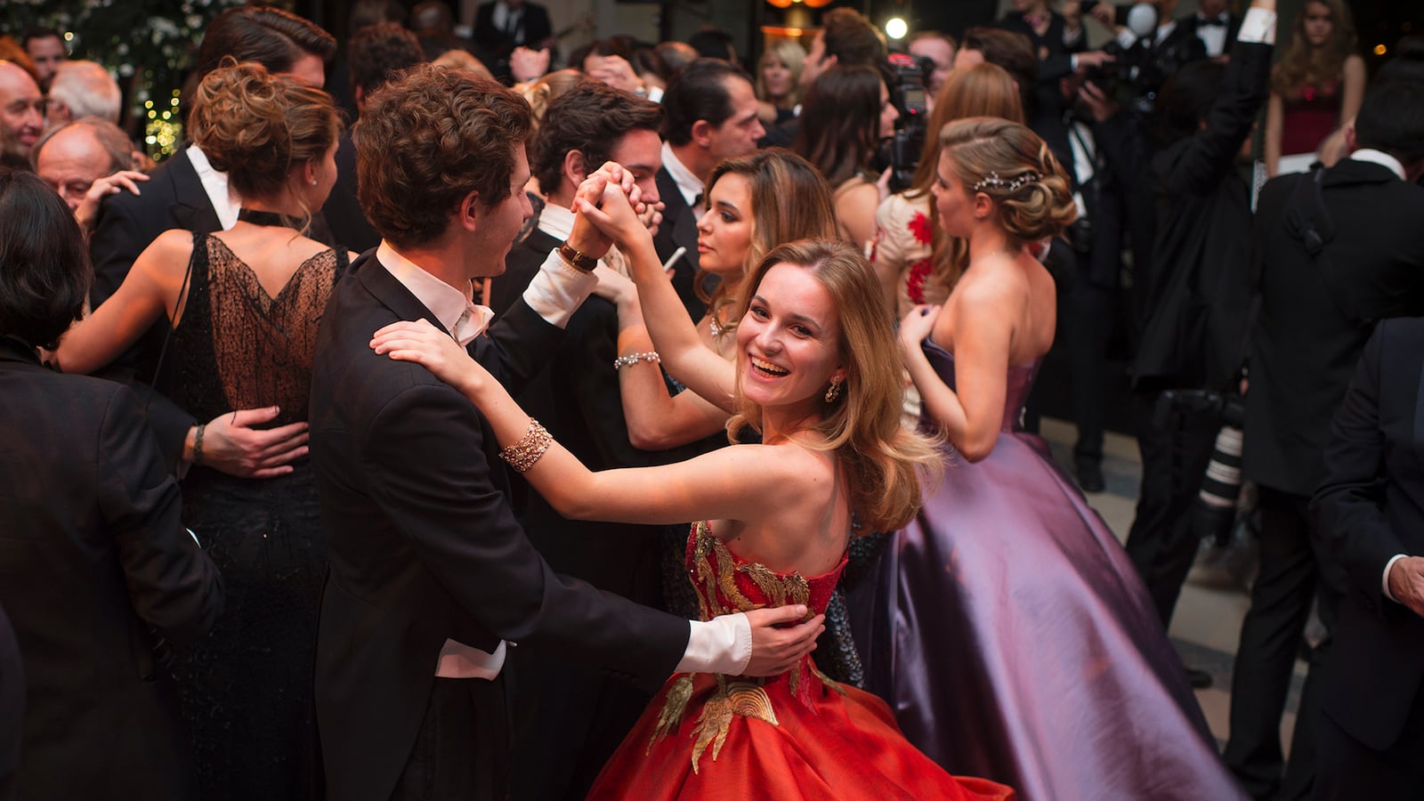 Brazil's Ginevra Fontes Williams, the daughter of Brazil's businessman Luiz Fontes Williams and Italian princess Valentina Moncada, dances with her partner Victor Belmondo, the son of Paul Belmondo, during the 22nd Debutantes Ball (le Bal des Débutantes) on November 29, 2014 at the Palais de Chaillot in Paris.