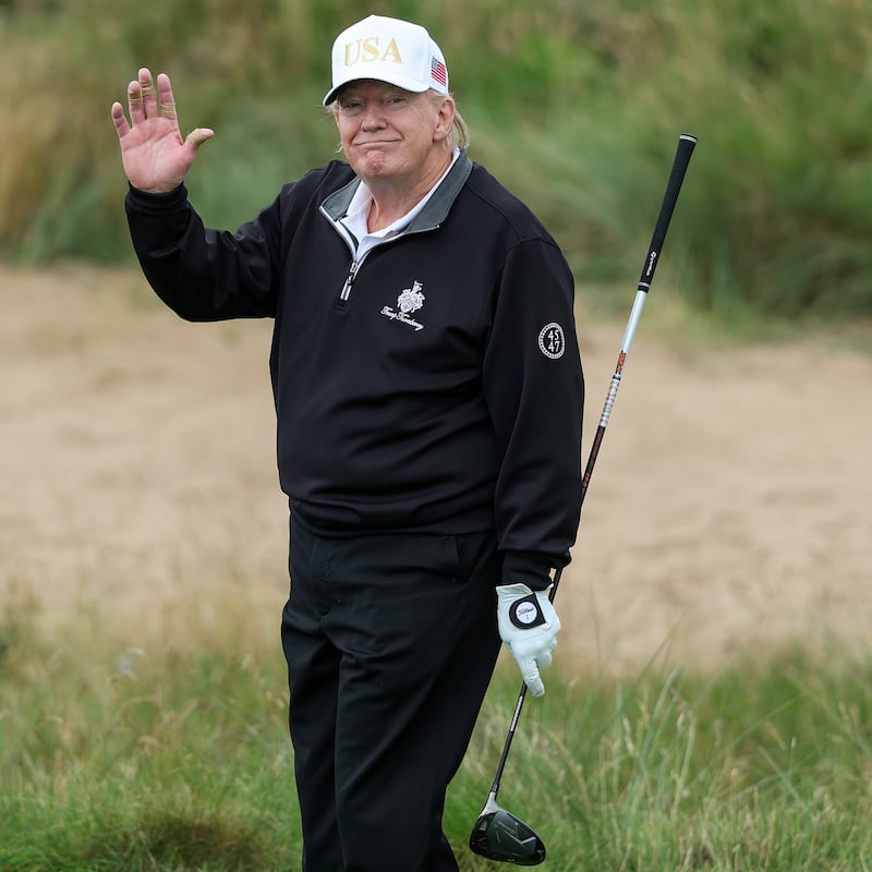 BALMEDIE, SCOTLAND - JULY 29: U.S. President Donald Trump holds a driver after teeing off during the opening of his new golf course at his Trump International Golf links resort on July 29, 2025 in Balmedie, Scotland. President Trump is visiting Scotland in a trip that’s part-vacation, part-work, as he stayed at his Trump Turnberry golf course, followed by Trump International Golf Links in Aberdeenshire, between July 25 to 29. (Photo by Jeff J Mitchell/Getty Images)