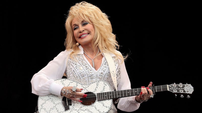 American country music star Dolly Parton performs on the Pyramid Stage at Worthy Farm in Somerset, during the Glastonbury Festival on June 29, 2014.