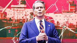 A photo illustration of United States Secretary of the Treasury Scott Bessent in front of oil tankers.