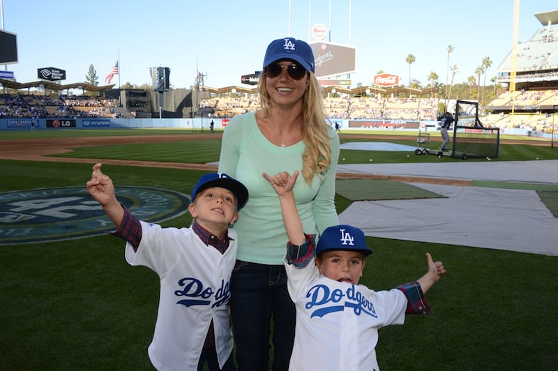 Britney Spears poses with sons Jayden James Federline (L) and Sean Preston Federline (R) during a game against the San Diego Padres at Dodger Stadium on April 17, 2013 in Los Angeles, California.