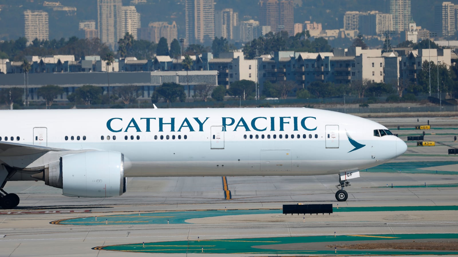 LOS ANGELES, CALIFORNIA - OCTOBER 17: A Cathay Pacific Boeing 777 airplane taxis at Los Angeles International Airport after arriving from Hong Kong on October 17, 2025 in Los Angeles, California.