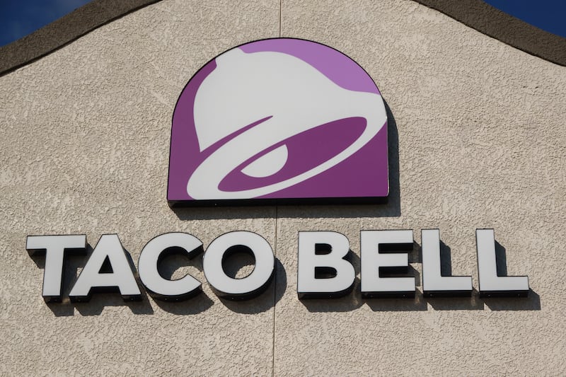 SAN DIEGO, CALIFORNIA - JANUARY 9: A Taco Bell logo is displayed on a sign outside of a restaurant on January 9, 2026 in San Diego, CA. (Photo by Kevin Carter/Getty Images)
