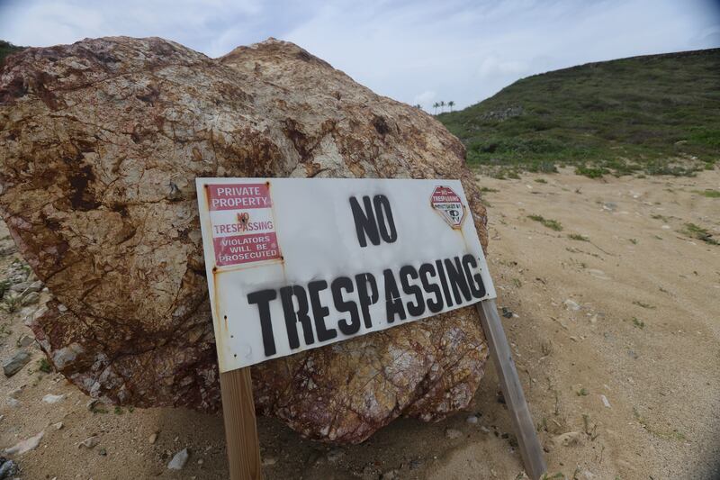 A “No Trespassing” sign sits on the grounds of Jeffrey Epstein’s estate in the Caribbean.