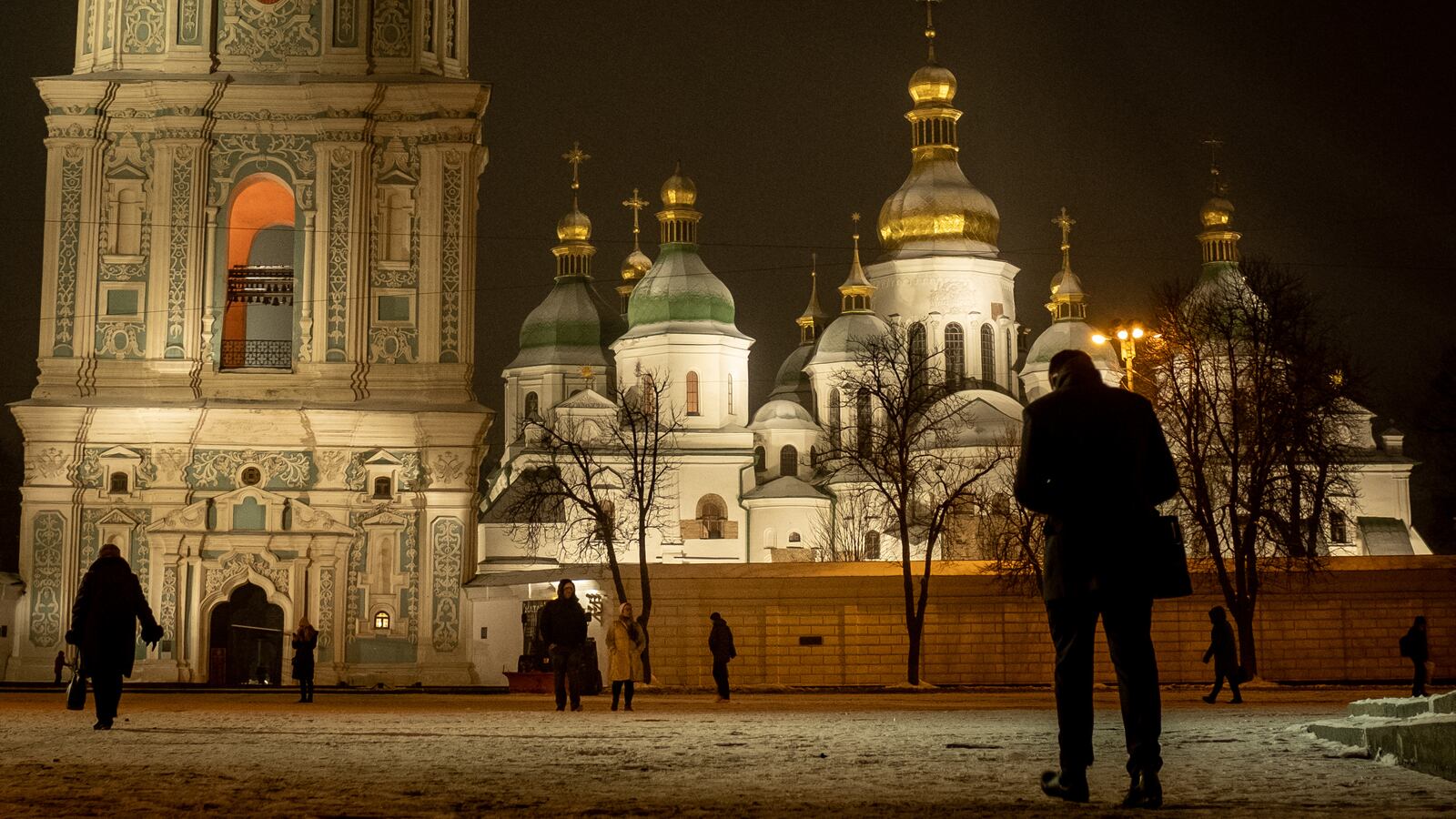 People walk past Saint Sophia Cathedral at Sophia Square, Kyiv, Ukraine.