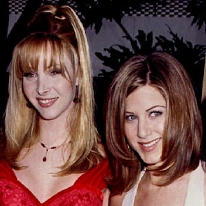Actresses from the television series "Friends" pose together as they arrive at the 53rd Annual Golden Globes Awards