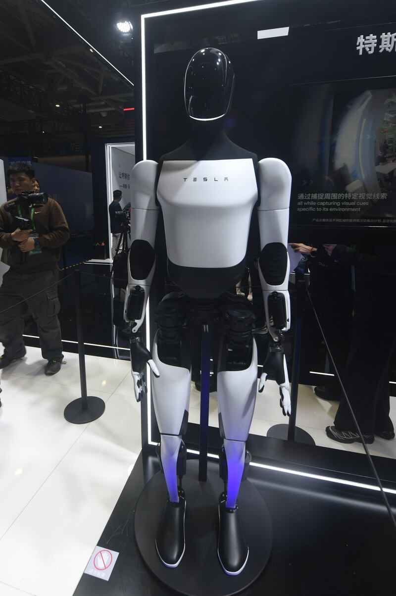 A Tesla Bot is showcased at the Tesla booth at the 8th CIIE in Shanghai, China, on November 6, 2025