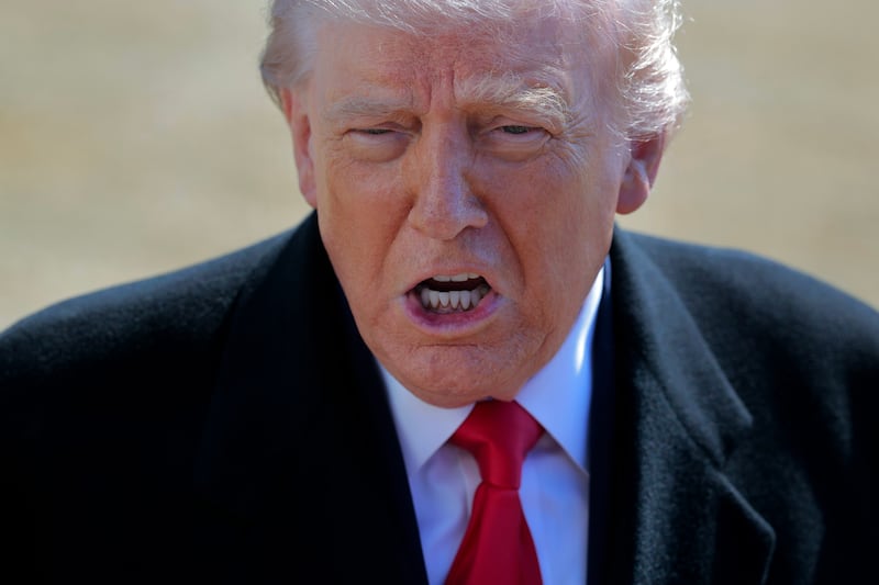 U.S. President Donald Trump talks with reporters before he and first lady Melania Trump leave the White House on February 13, 2026 in Washington, DC.