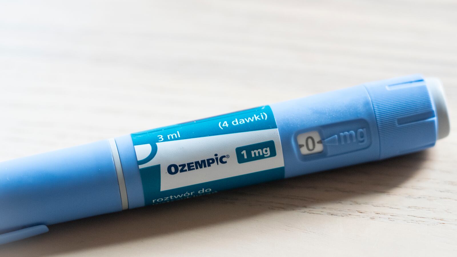 An Ozempic (semaglutide) injection pen is seen on a kitchen table.