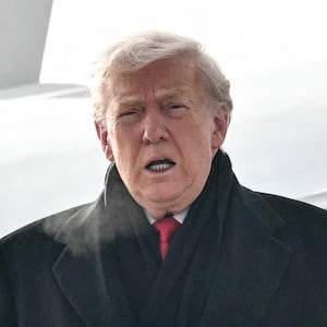 President Donald Trump steps off Air Force One upon arrival at Zurich Airport on Jan. 21, 2026.