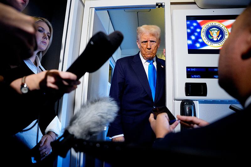 U.S. President Donald Trump speaks to journalists aboard Air Force One en route to South Korea on October 29, 2025 in Japan. Trump is traveling to South Korea for the APEC meetings, following an appearance at the ASEAN summit in Malaysia, and a trip to Japan.