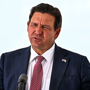 Florida Governor Ron DeSantis speaks during a press conference at the South Florida Detention Facility, nicknamed "Alligator Alcatraz," at the Dade-Collier Training and Transition Airport in Ochopee, Florida, on June 25, 2026. DeSantis announced that the facility is now closed and all detainees have been relocated. (Photo by CHANDAN KHANNA / AFP via Getty Images)