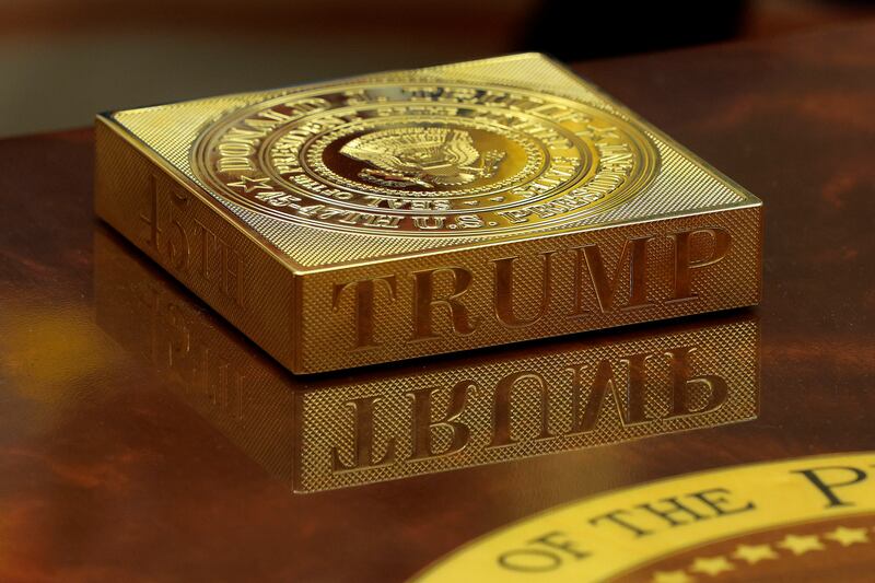 A gold drink coaster box sits on U.S. President Donald Trump's coffee table.