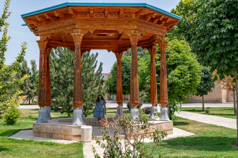 Tourist on the way to the Kok Gumbez mosque in Dorut Tilovat complex of Shahrisabz, Uzbekistan