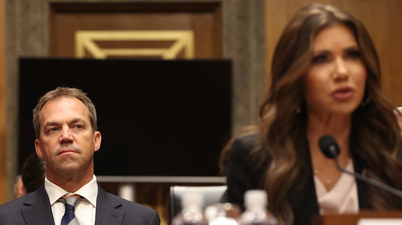 Bryon Noem (L), husband of US Secretary of Homeland Security Kristi Noem (R), listens  as Secretary Noem testifies before the Senate Committee on Homeland Security and Governmental Affairs to examine the President's proposed budget request for fiscal year 2026 for the Department of Homeland Security, on Capitol Hill in Washington, DC, May 20, 2025.