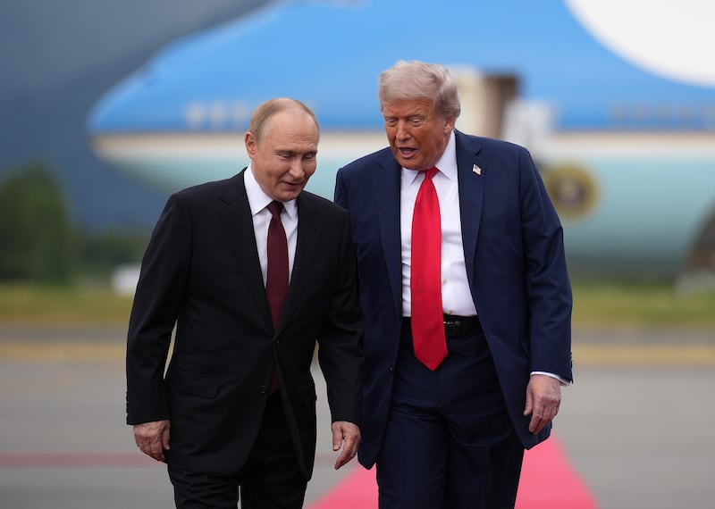 ANCHORAGE, ALASKA - AUGUST 15: U.S. President Donald Trump (R) walks with Russian President Vladimir Putin as they arrives at Joint Base Elmendorf-Richardson on August 15, 2025 in Anchorage, Alaska. The two leaders are meeting for peace talks aimed at ending the war in Ukraine. (Photo by Andrew Harnik/Getty Images)