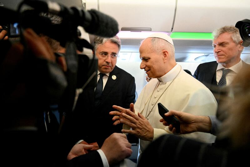 Pope Leo XIV addresses journalists during the flight heading to Algiers on April 13, 2026. Pope Leo XIV embarks today on an 11-day visit to Algeria, Cameroon, Angola and Equatorial Guinea for his first major international trip since becoming pontiff last year.     ALBERTO PIZZOLI/Pool via REUTERS